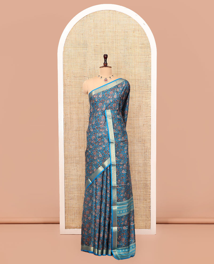 Blue Printed Silk Saree Features an Intricate Design, a Traditional Zari Border, an Intricate Pallu, and Matching Blouse