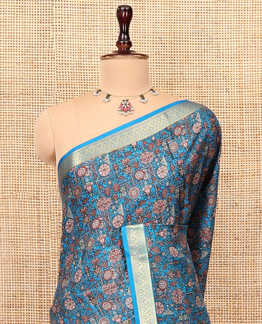 Blue Printed Silk Saree Features an Intricate Design, a Traditional Zari Border, an Intricate Pallu, and Matching Blouse