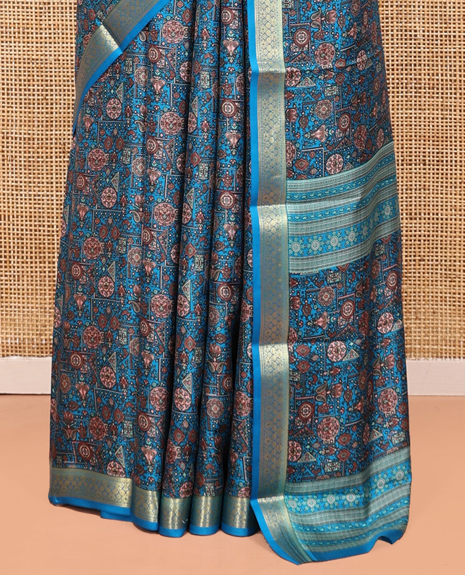 Blue Printed Silk Saree Features an Intricate Design, a Traditional Zari Border, an Intricate Pallu, and Matching Blouse