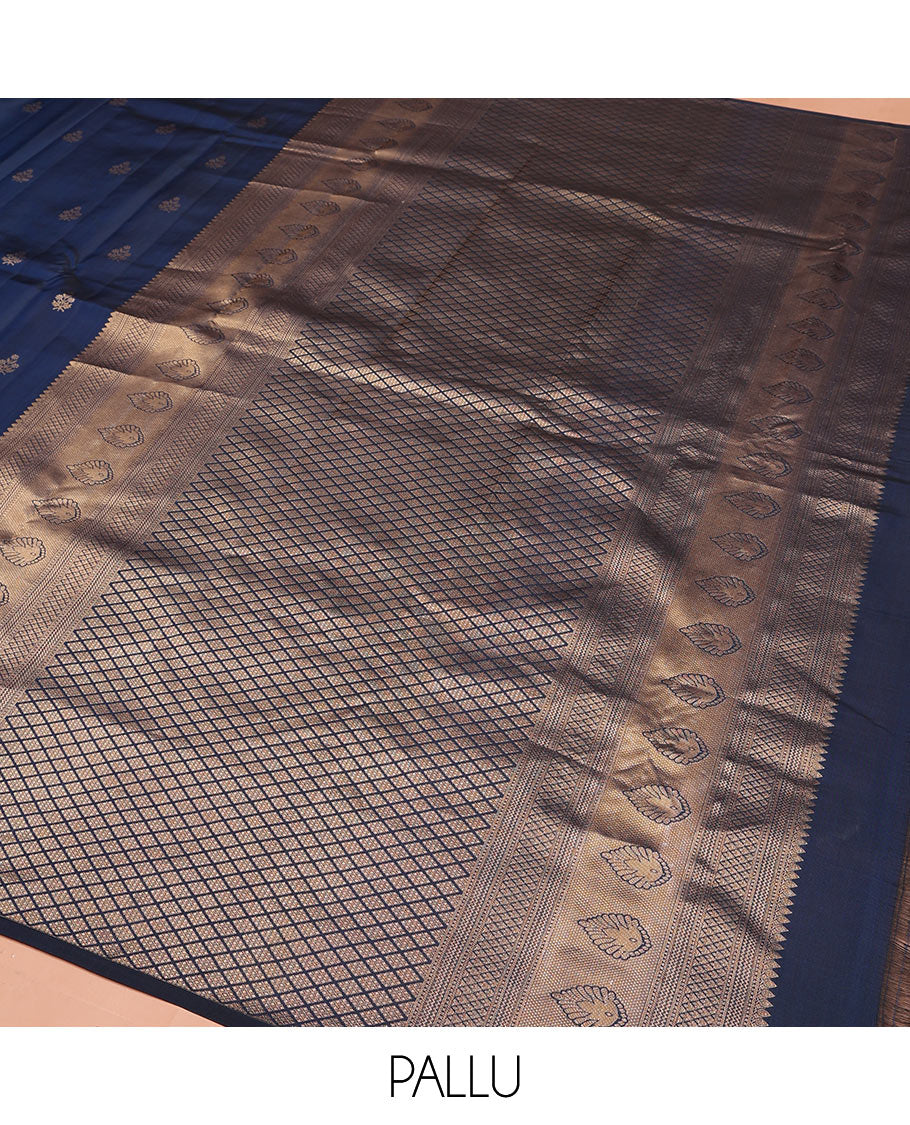 Blue Vasundhara Silk Saree Gleamed Up with Zari Buttas All Over Its Body, Highlighted by a Zari Border of Wedding-Themed Bridegroom Designs, Pallu Majestically Detailed with Jaal Designs, and Paired with a Matching Blouse