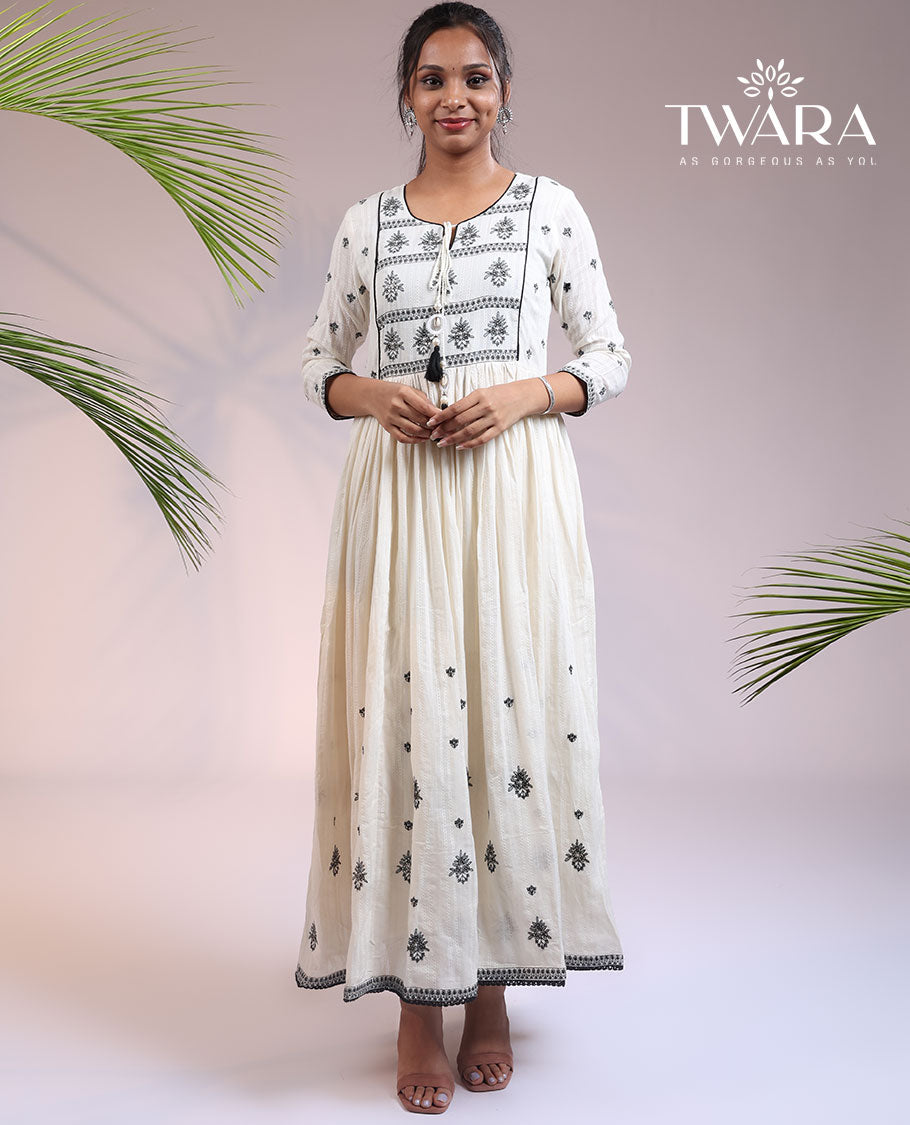 Twara cream floral thread embroidered 3/4th sleeve & round neck cotton a-line umbrella full-length kurti