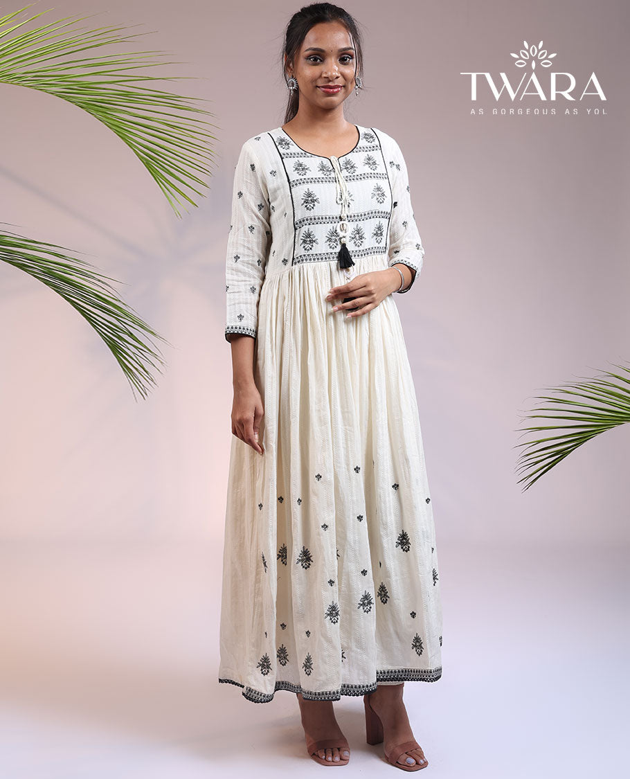 Twara cream floral thread embroidered 3/4th sleeve & round neck cotton a-line umbrella full-length kurti
