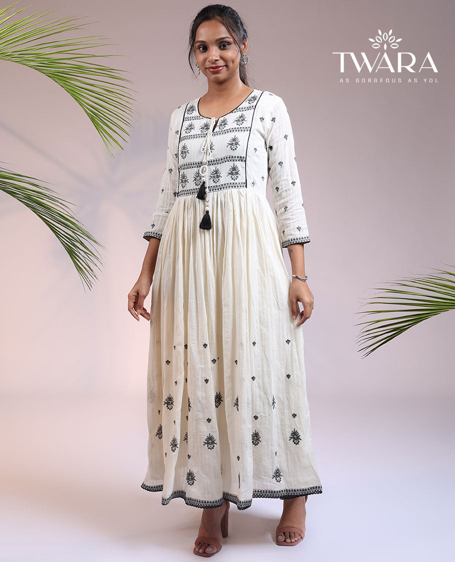 Twara cream floral thread embroidered 3/4th sleeve & round neck cotton a-line umbrella full-length kurti