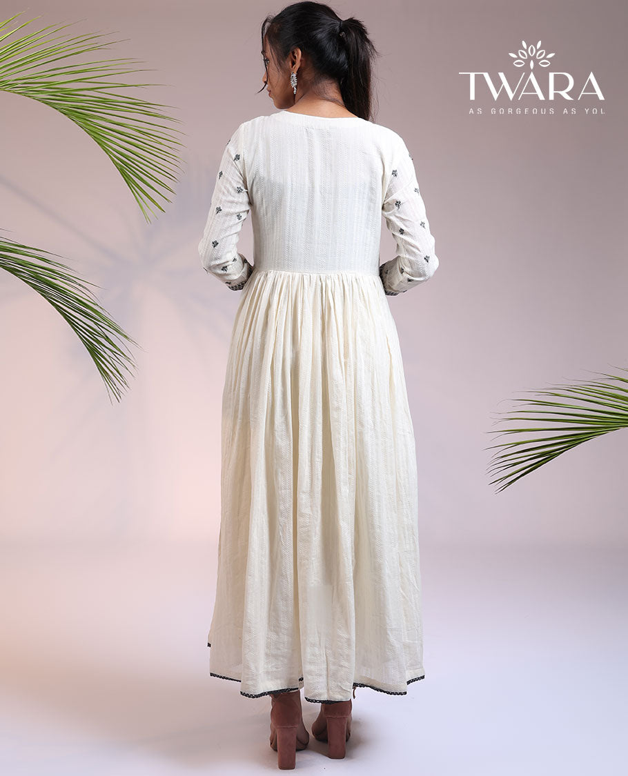 Twara cream floral thread embroidered 3/4th sleeve & round neck cotton a-line umbrella full-length kurti