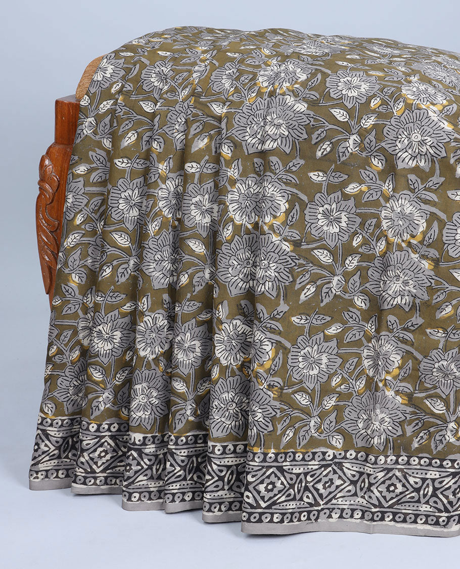 Green floral vine printed mul-mul cotton saree, contrast border & pallu steeped with geometric print