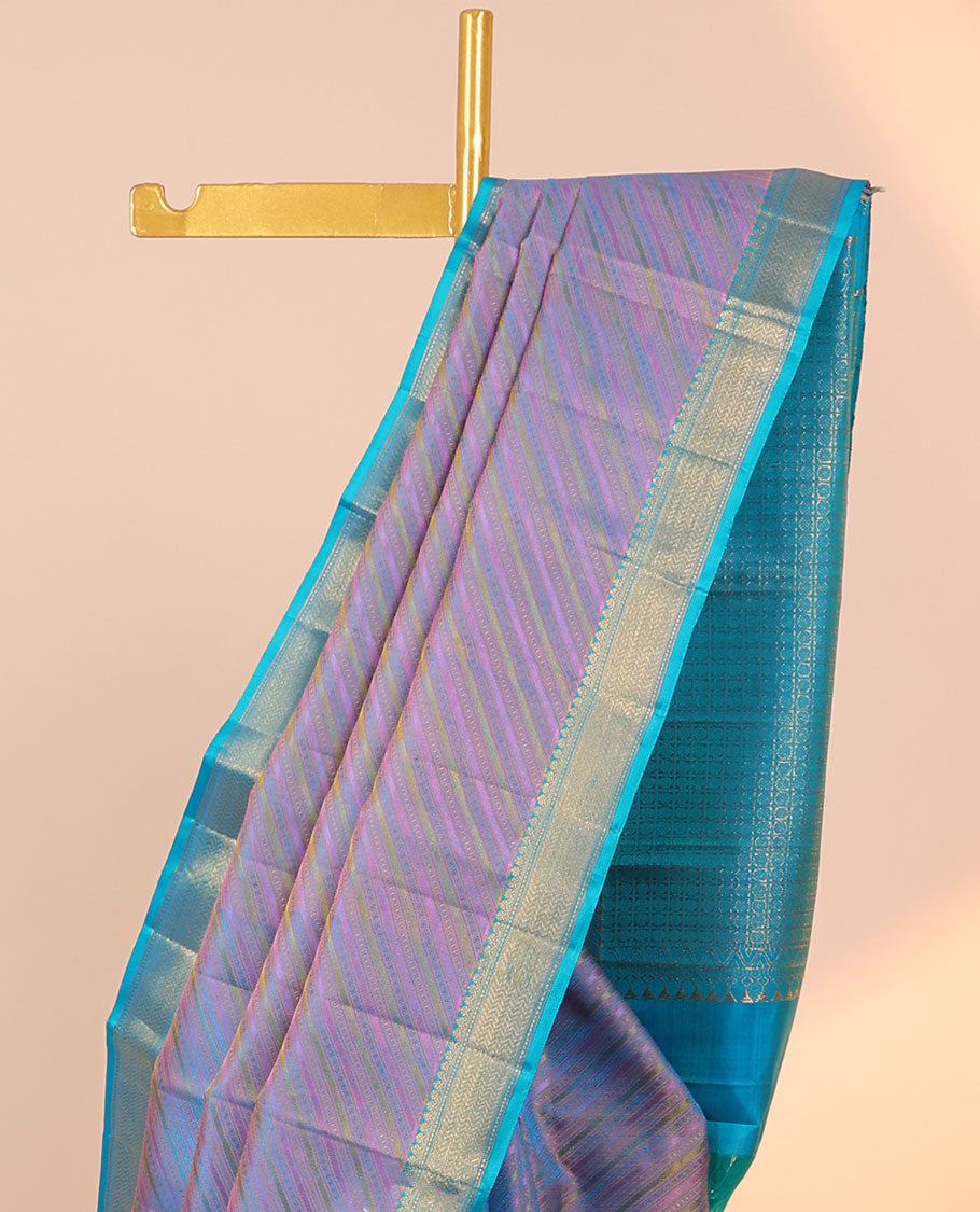 Violet embossed & zari butta silksaree,contrast border of thilakam mokku,muthu & vanki design & pallu of poun