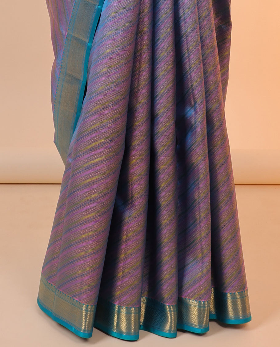 Violet embossed & zari butta silksaree,contrast border of thilakam mokku,muthu & vanki design & pallu of poun