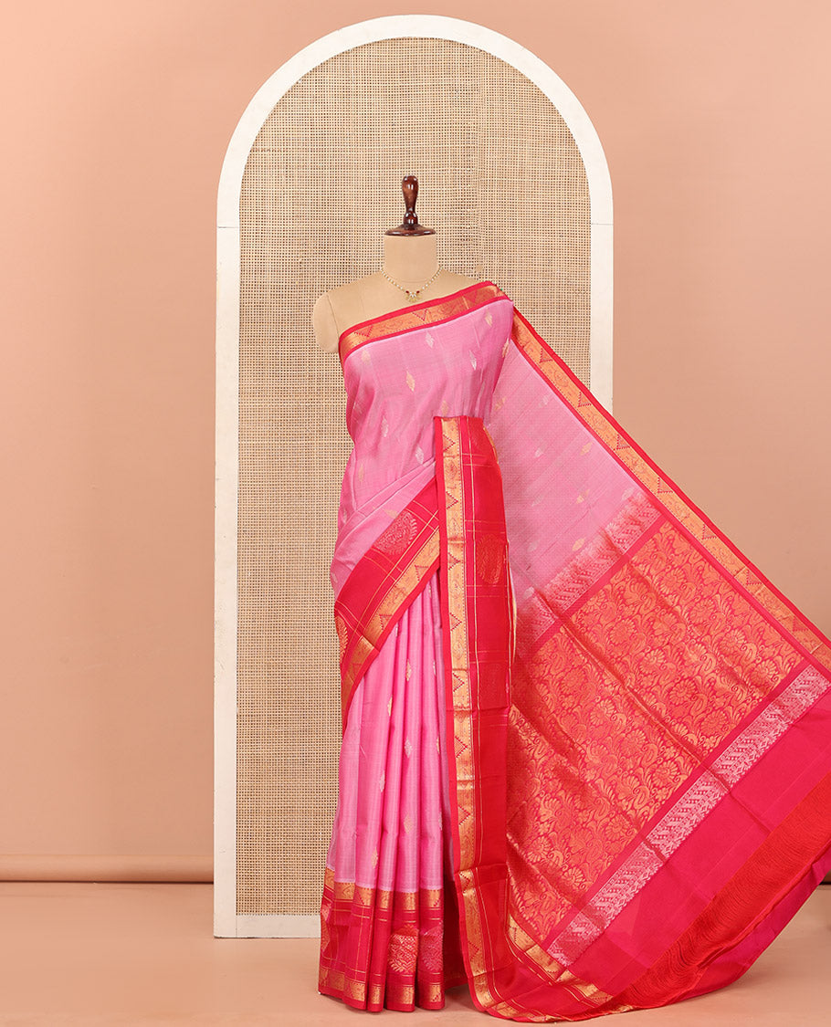 Pink Uppada Silk Saree Detailed with Zari Buttas All Over Its Body, Complemented by a Contrast Border of Traditional Zari Designs, Sparsely Sparkled Pallu of Floral-Paisley Designs, and Paired with a Contrast Blouse