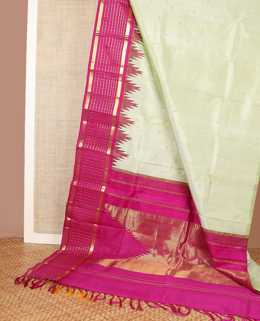 Pale green zari buttas kanchipuram silk saree, contrast one-sided thazampoo rekku muthu kattam border & pallu of zari stripes & thazampoo rekku