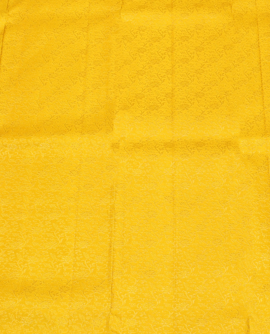 Yellow Pure Silk Half-Saree, Sparsely Woven with Floral Jacquard All Over Its Skirt, Complemented by a Contrast Korvai Border of Thilakam Mokku, Paisa, and Diamond Designs, Paired with a Contrast Blouse, and Comes with a Jaal Design Dhavani