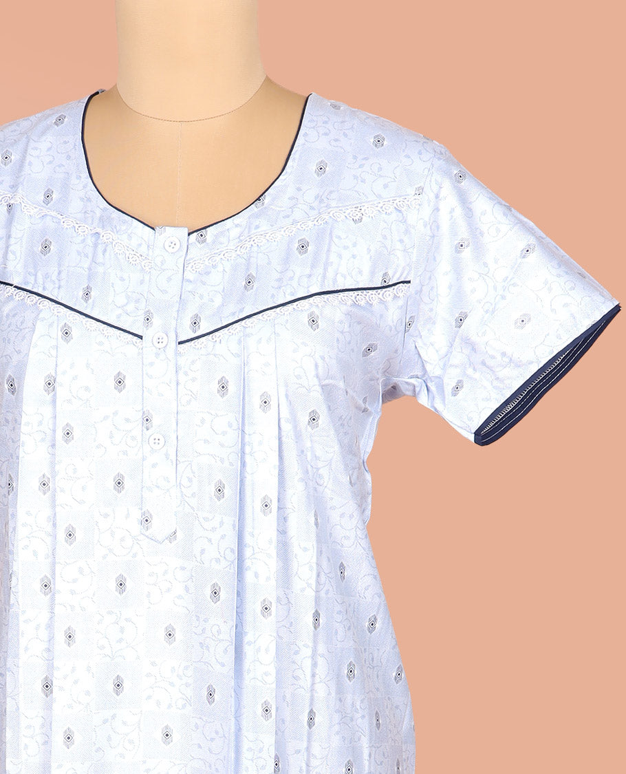 Pale Blue Cotton Nighty Adorned with Vine-Geometric Patterns Print, Featuring Lace Neck Work, Round Front Neck, and Half Sleeves