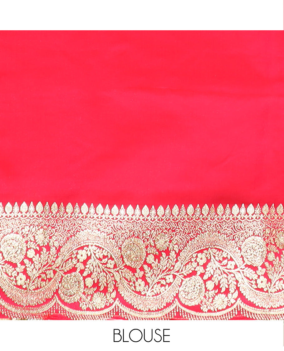 Orange Art Vastrakala Silk Saree Bedecked with Zari Buttas with Stone Work All Over Its Body, Complemented by a Contrast Floral Scallop Design Zari Stone Work Border, Mughal-Design Pallu Detailed in Zari and Stone Work, and Paired with a Contrast Blouse