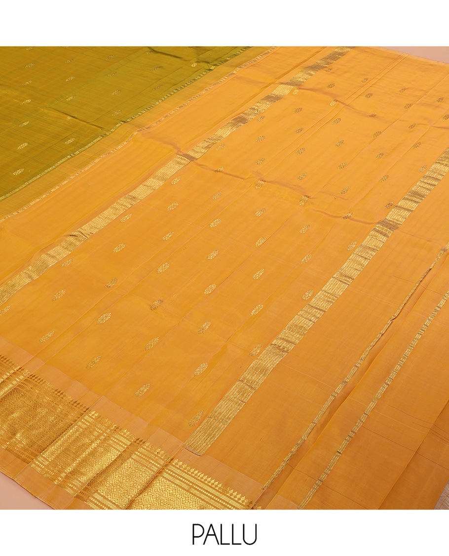 Green Kanchipuram Silk Saree, Accentuated with Zari Buttas, a Contrast One-sided Border of Panner Sombu, Banaras, Muthu, and Jaal Designs, Pallu of Zari Designs, and No Blouse