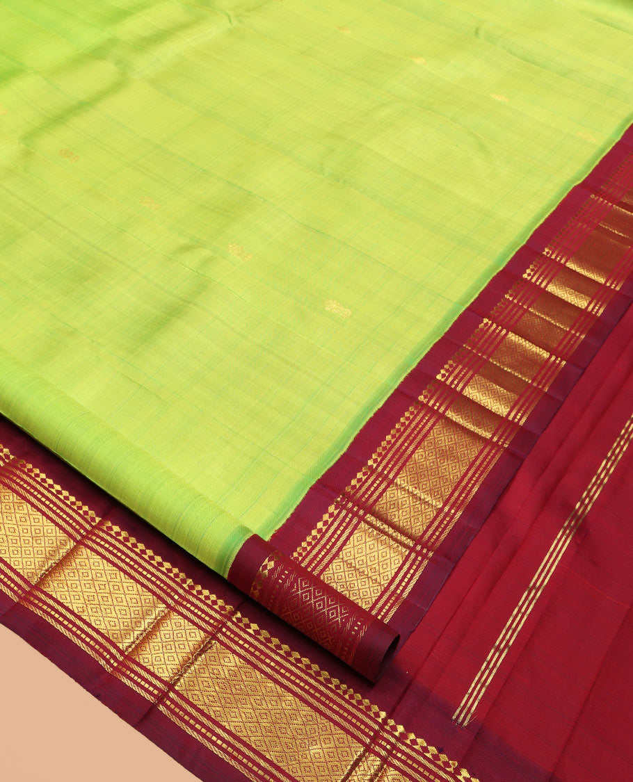 Green Kanchipuram Silk Saree, Woven with Zari Buttas, a Contrast One-Sided Korvai Border of Panner Sombu, Banaras, Muthu, and Mayil Kann Designs, Zari Design Pallu, and a No Blouse