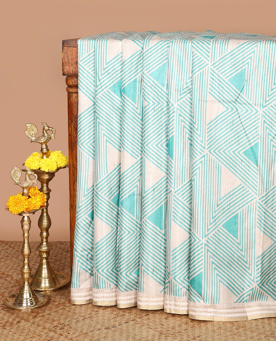 Chikku color with green block geometric print fancy tussar silk saree with zari resam border & block print pallu along striped blouse