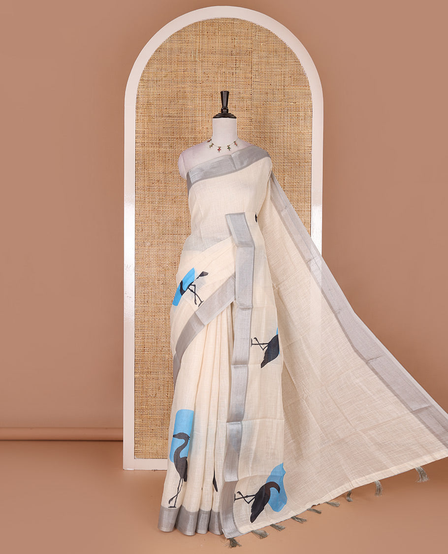 Cream hand painting style deer motifs printed linen cotton saree, silver bavanji border, and vertical stripes printed blouse