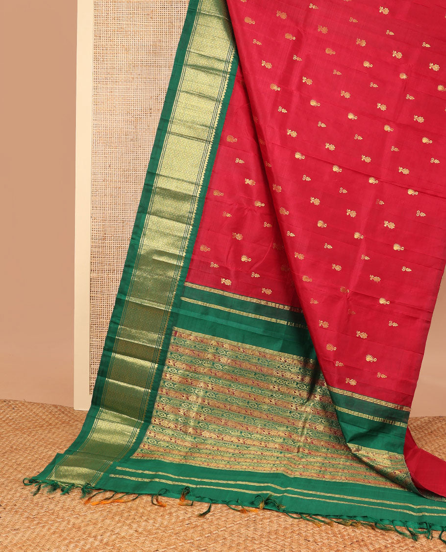 Red buttas kancheepuram silk saree with contrast korvai border of banaras, thilakam mokku, kuyil kann design & floral design pallu