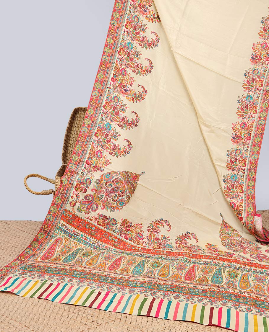 Cream semi-banaras dola silk saree with contrast floral motif border & paisley motifs pallu