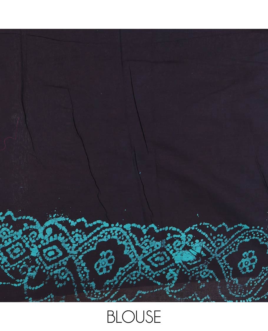 Black-blue batik geometric printed pure cotton saree, zari piping border, human figurines batik printed pallu, and a matching batik printed blouse