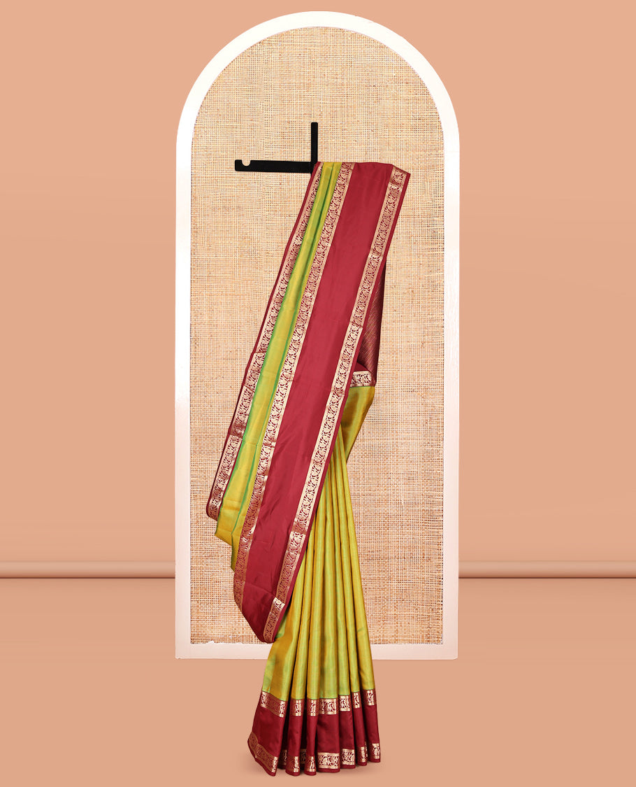 Green Plain Kanchipuram Silk Saree, Complemented by a Contrast Rettai Pettu Border of Kodi Visiry Designs, Grand Pallu, and a Contrast Blouse