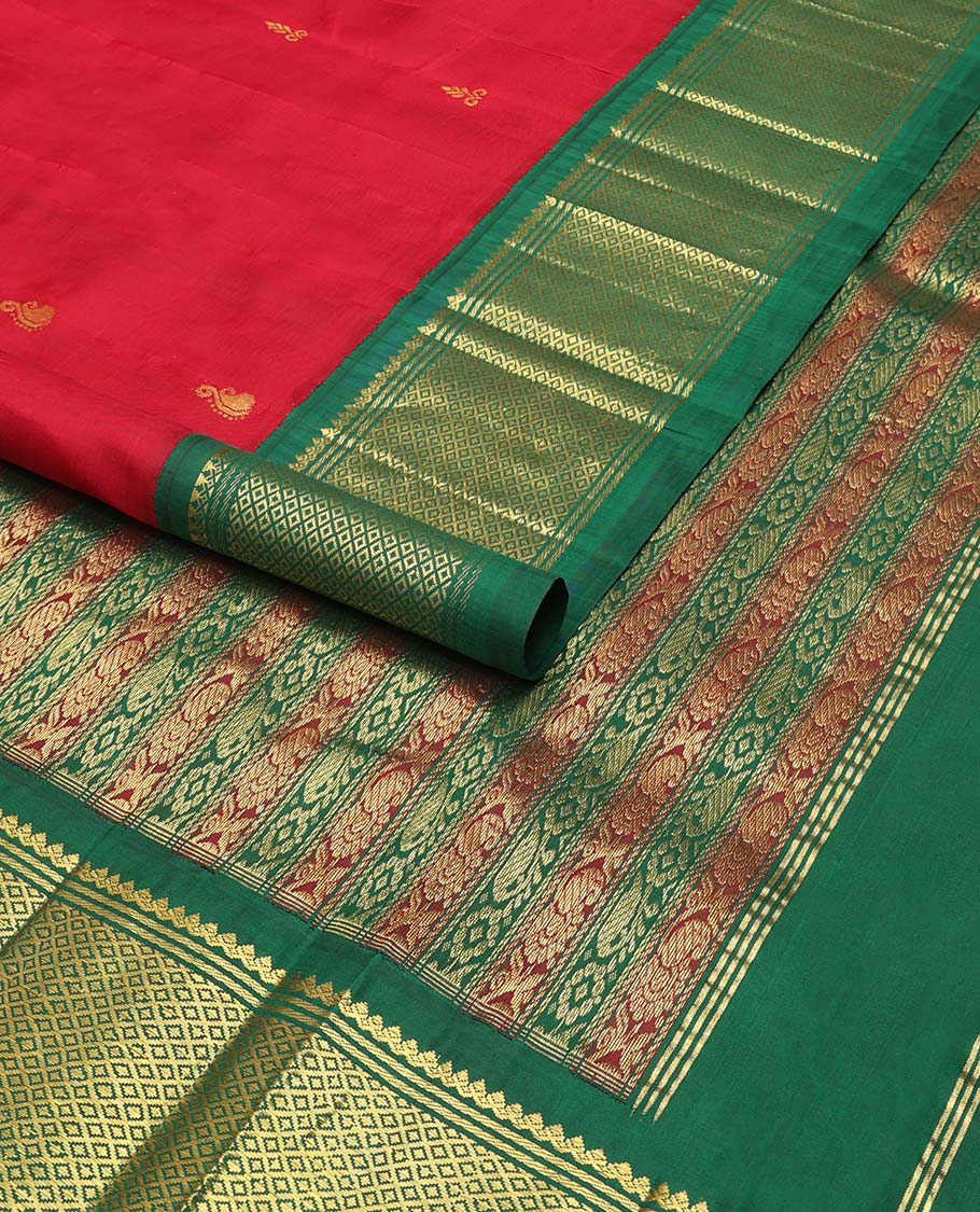 Red buttas kancheepuram silk saree with contrast korvai border of banaras, thilakam mokku, kuyil kann design & floral design pallu