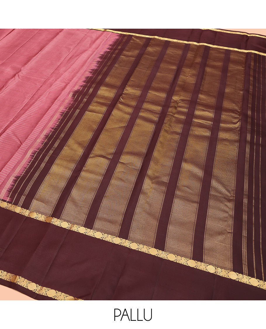Pink Kanchipuram Silk Saree, Subtly Enriched with Zari Stripes All Over Its Body, Complemented by Contrast Rettai Pettu Border of Mayil and Rudraksham Designs, Gleaming Zari-Striped Pallu, and Paired with a Contrast Blouse