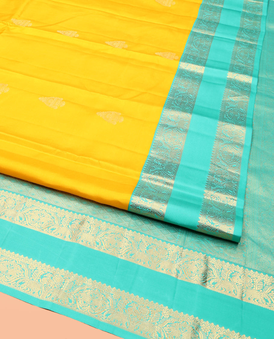 Yellow Vasundhara Silk Saree, Woven with Zari Buttas, Complemented by a Contrast Rettai Pettu Mayil-Yaanai Border, Jaal Pallu, and a Contrast Blouse