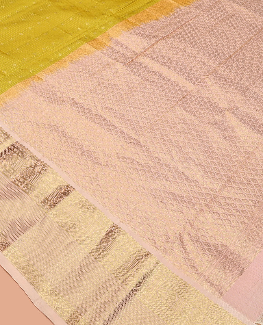 Yellow zari buttas and micro-checked Vasundhara silk mix saree, contrast border of thilakam mokku, banaras, paisa, mayil, banaras, and zari design, and peacock feather motifs pallu