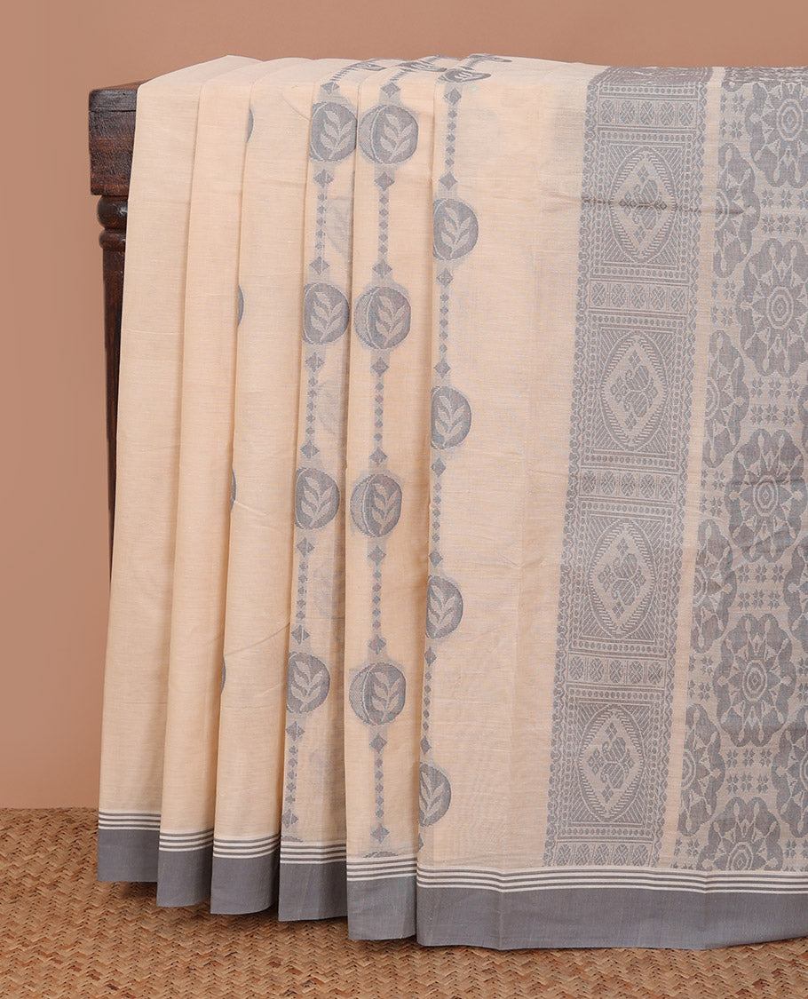 Cream unique motifs kanchi cotton saree, contrast plain border, and pallu of chakram motifs