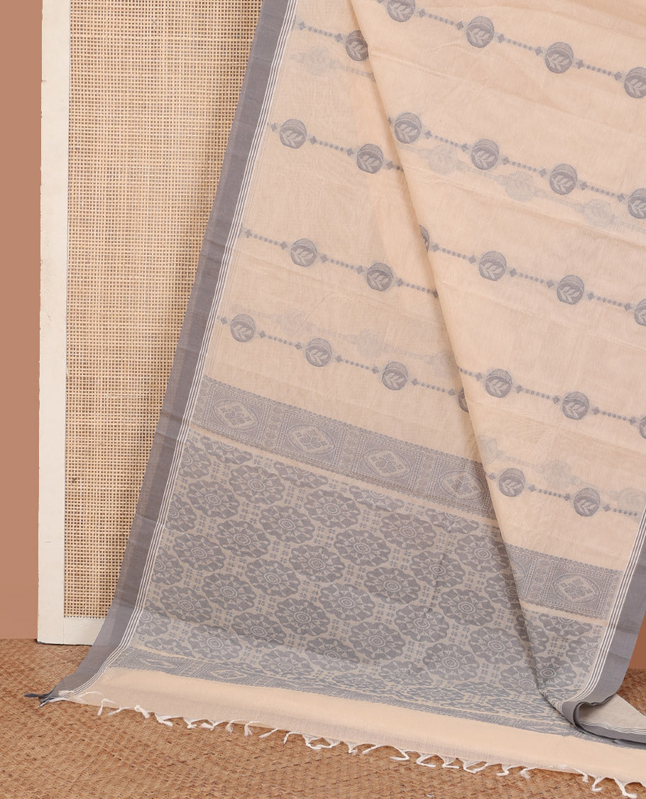 Cream unique motifs kanchi cotton saree, contrast plain border, and pallu of chakram motifs