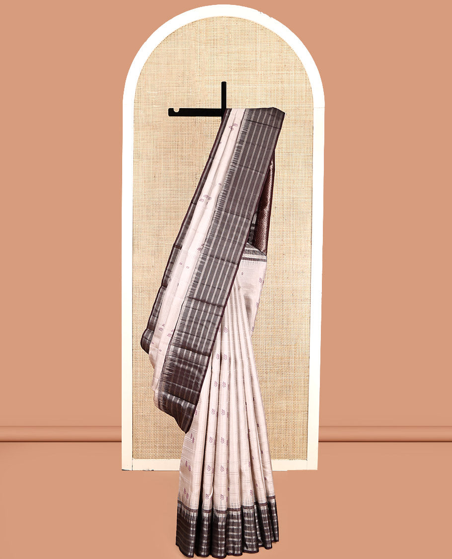 Off-White Kanchipuram Silk Saree, Subtly Sparkled with Buttas and Stripes, Complemented by Contrast Zari Striped Border, Pallu of Intricate Designs, and a Contrast Blouse