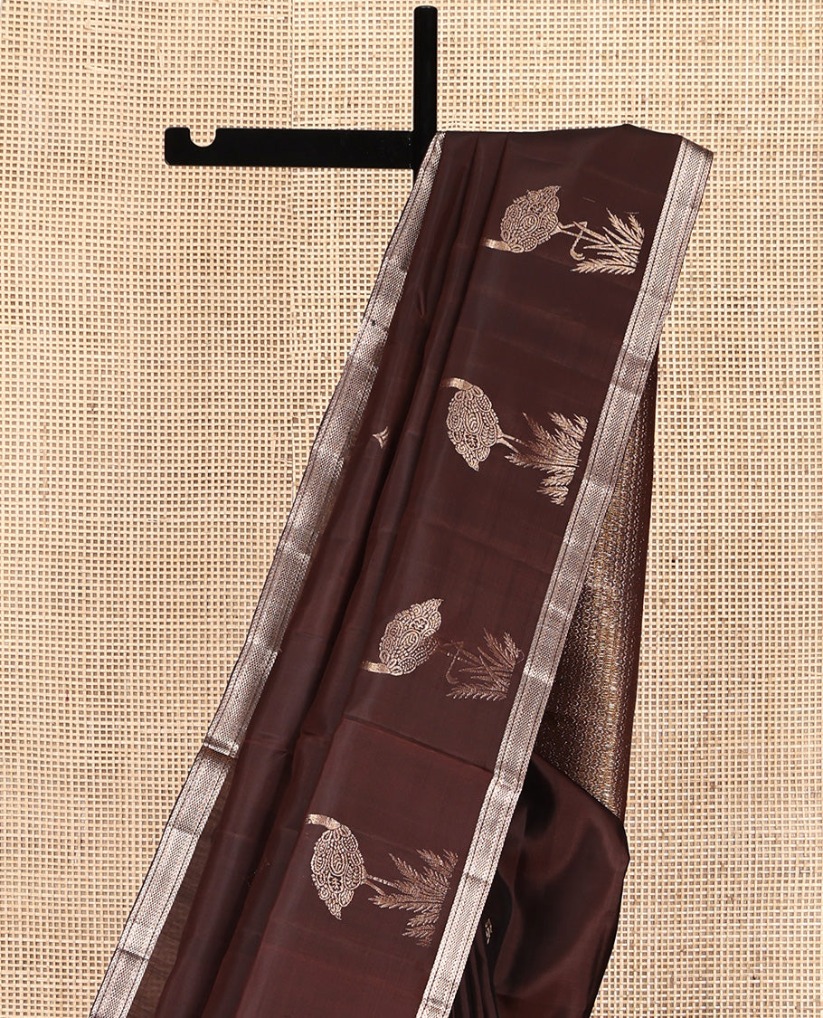 Brown Mayuri Soft Silk Saree, Spotlighted with Zari Buttas All Over Its Body, Highlighted by Piping Zari Border, Intricately Designed Pallu and Paired with a Matching Blouse