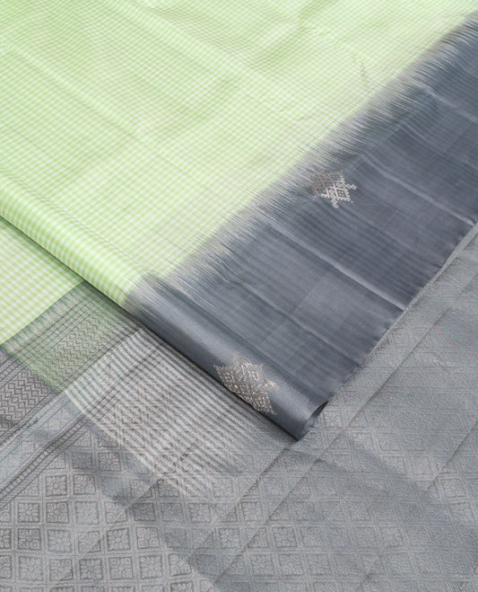 Green micro-checked soft silk saree, contrast kolam butta border & pallu of jaal design