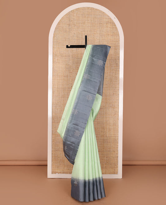 Green micro-checked soft silk saree, contrast kolam butta border & pallu of jaal design