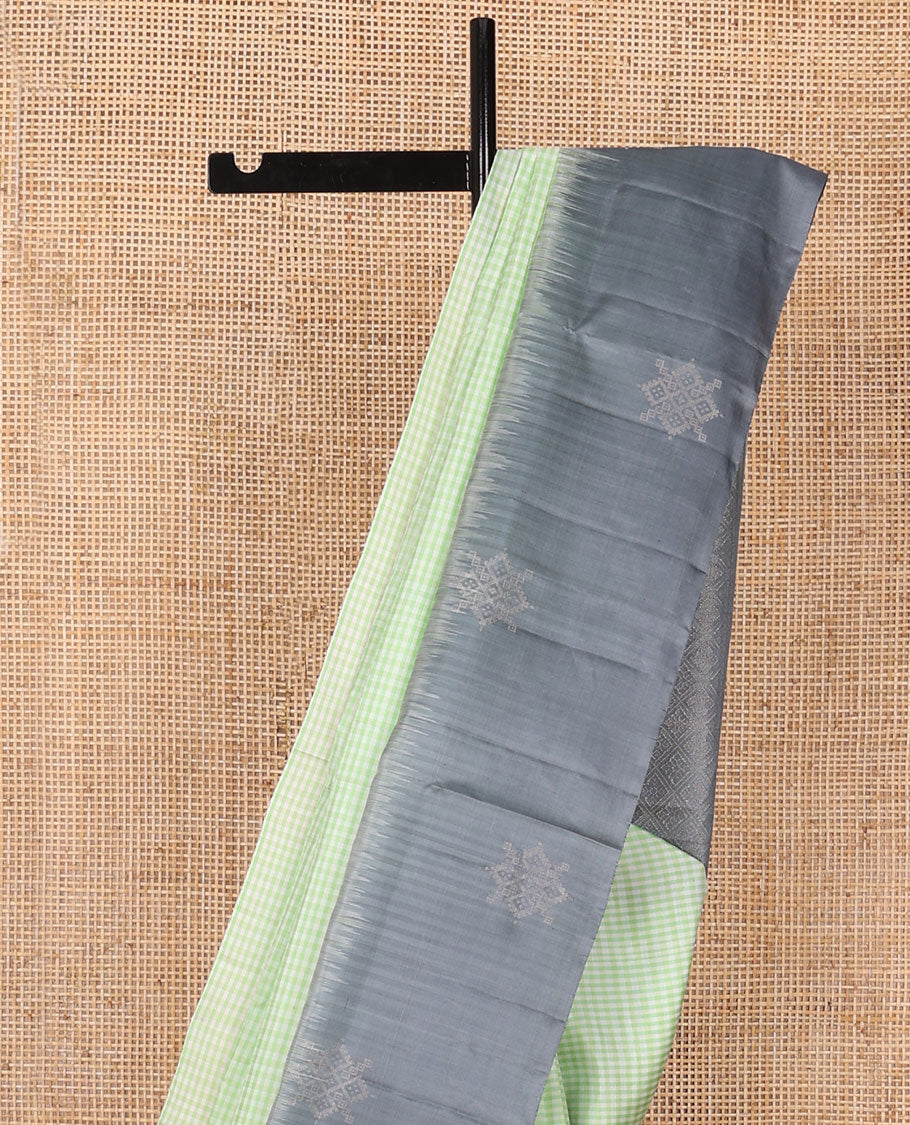 Green micro-checked soft silk saree, contrast kolam butta border & pallu of jaal design