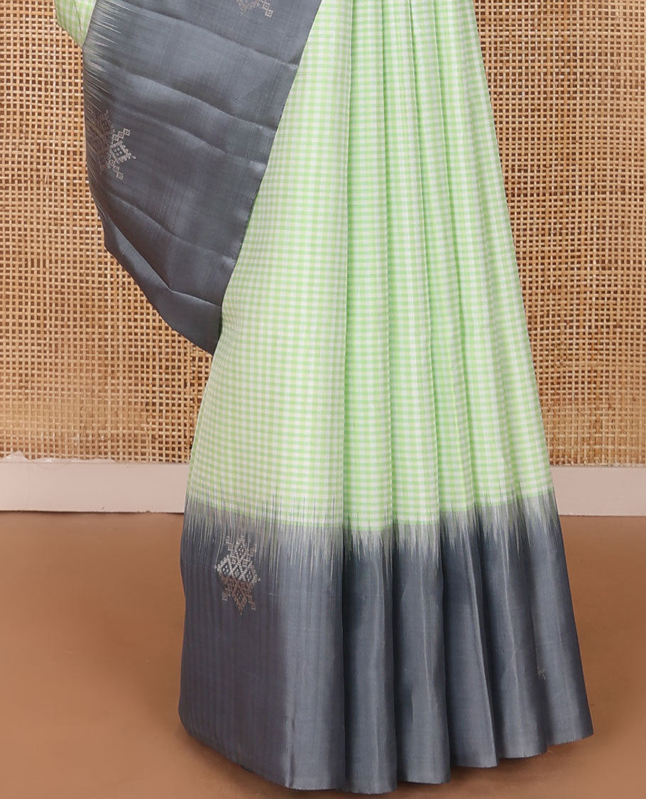 Green micro-checked soft silk saree, contrast kolam butta border & pallu of jaal design