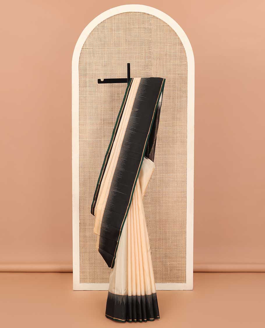 Cream soft silk saree, contrast zari border, and zari-rich pallu of temple and kodi rudraksham designs