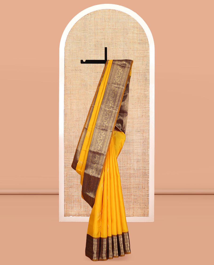 Yellow Vasundhara Lite Silk Mix Saree, Sparsely Woven with Zari Buttas, a Contrast Border of Mayil and Yaali Designs, Grand Pallu, and a Contrast Blouse