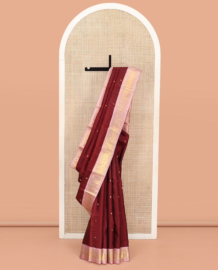 Maroon Vasundhara Silk Saree, Embellished with Zari Buttas All Over Its Body, Complemented by a Contrast Border of Manga, Banaras, Muthu, Neli, and Mayil Designs, Grand Pallu, and Paired with a Contrast Blouse