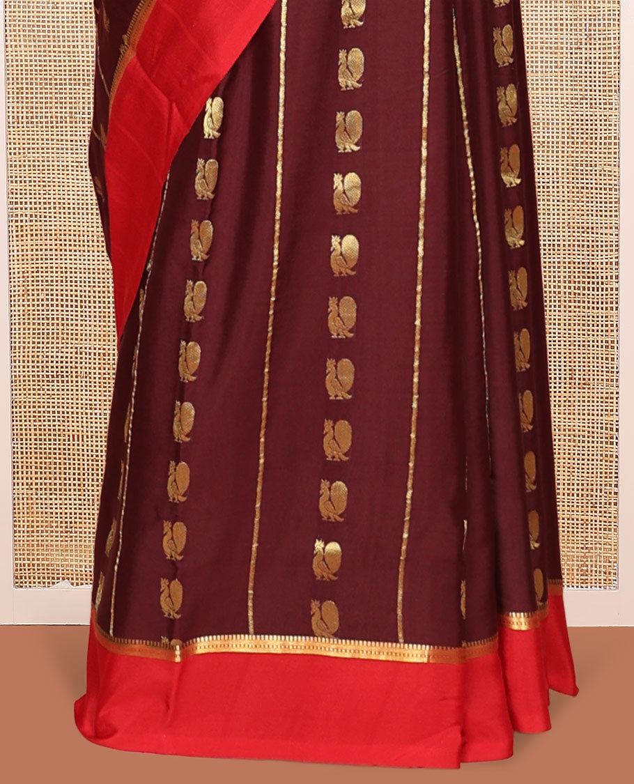 Brown Mysore Silk Saree, Ornamented With Zari Stripes and Peacock Buttas Across Its Body, Complemented by Captivating Contrast Border of Traditional Zari Designs, Pallu Steeped with Traditional Zari Designs, and Paired with a Contrast Blouse