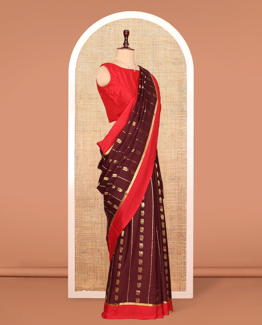 Brown Mysore Silk Saree, Ornamented With Zari Stripes and Peacock Buttas Across Its Body, Complemented by Captivating Contrast Border of Traditional Zari Designs, Pallu Steeped with Traditional Zari Designs, and Paired with a Contrast Blouse