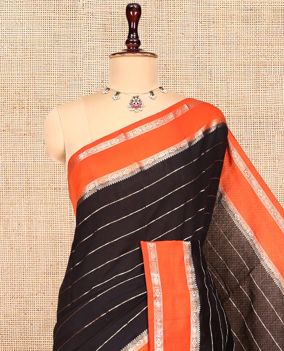 Black Assam Silk Saree, Charmingly Accented with Zari Stripes, Complemented by a Contrast Zari Traditional Border, Zari-Striped Pallu, and a Contrast Blouse