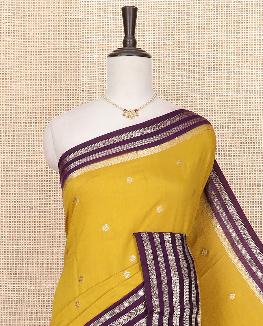 Yellow zari buttas woven Assam silk saree, contrast big border of traditional zari designs, and pallu of zari buttas and zari stripes