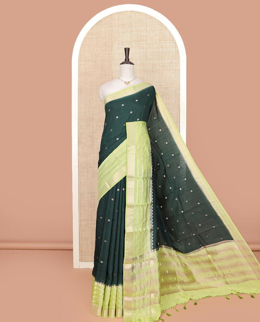 Dark Green Assam Silk Embellished with Floral Zari Buttas, Complemented by Contrast Traditional Zari Design Border, a Gleaming Pallu of Zari Stripes, and Paired with a Contrast Blouse