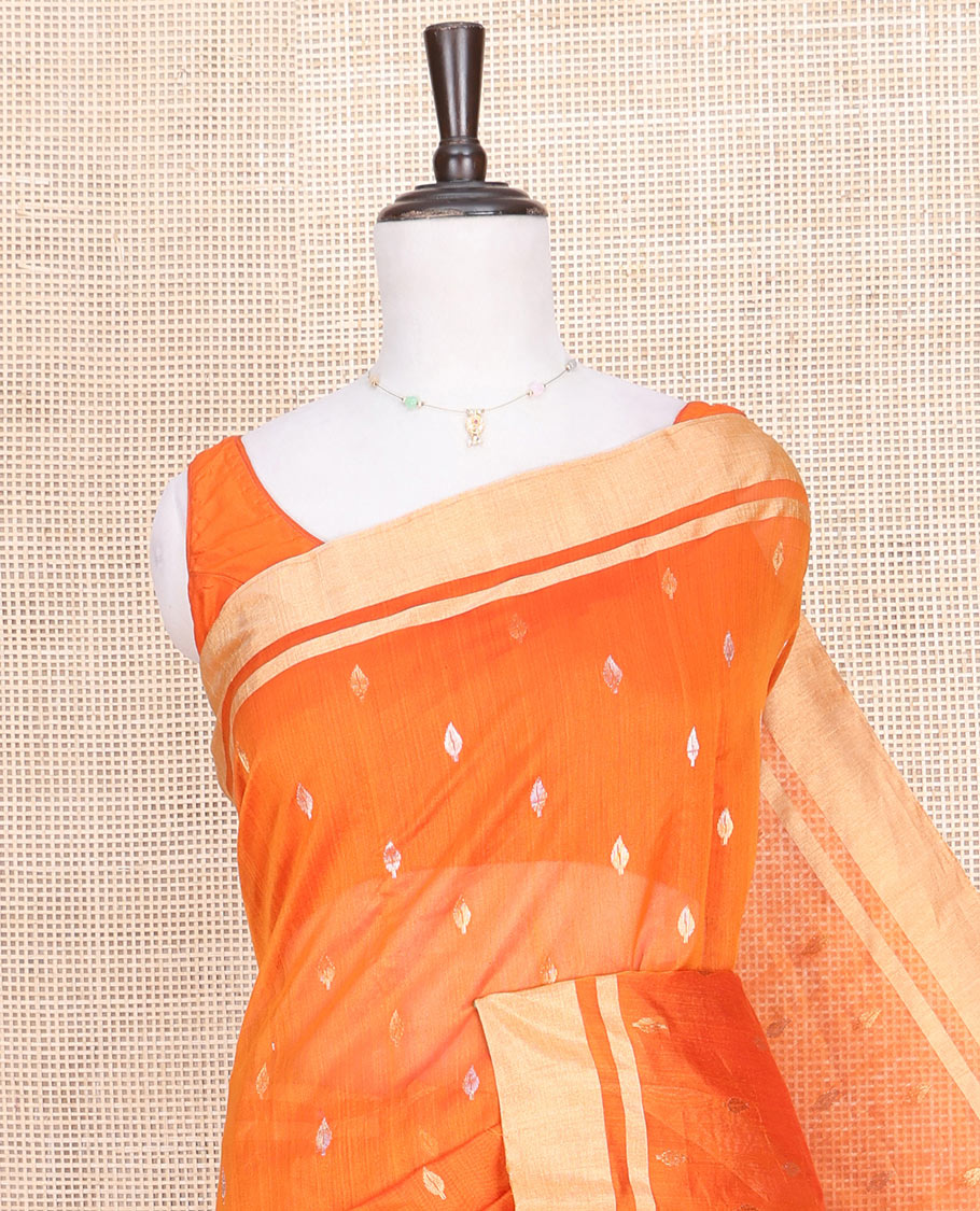 Orange Chanderi Cotton Saree, Decked Up with Buttas All Over Its Body, Highlighted by a Zari Border, Contrast Pallu Steeped with Floral Buttas, and Paired with a Contrast Blouse