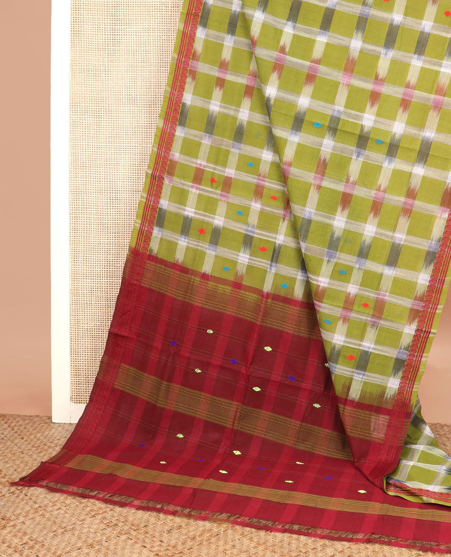 Green buttas and checked Andhra cotton saree, paisley border, and contrast pallu of stripes and buttas