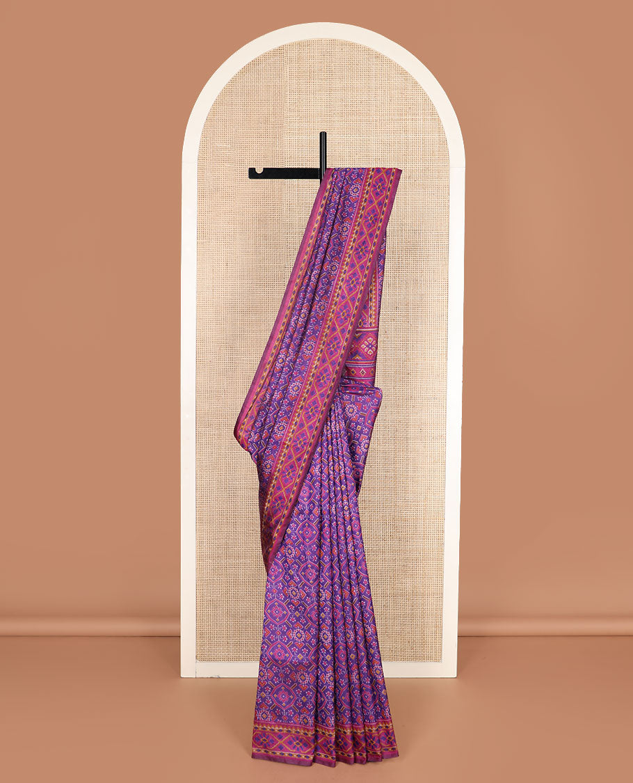 Violet intricately ikkat woven semi-banaras patola silk saree, diamond patterned border, and diamond patterned pallu