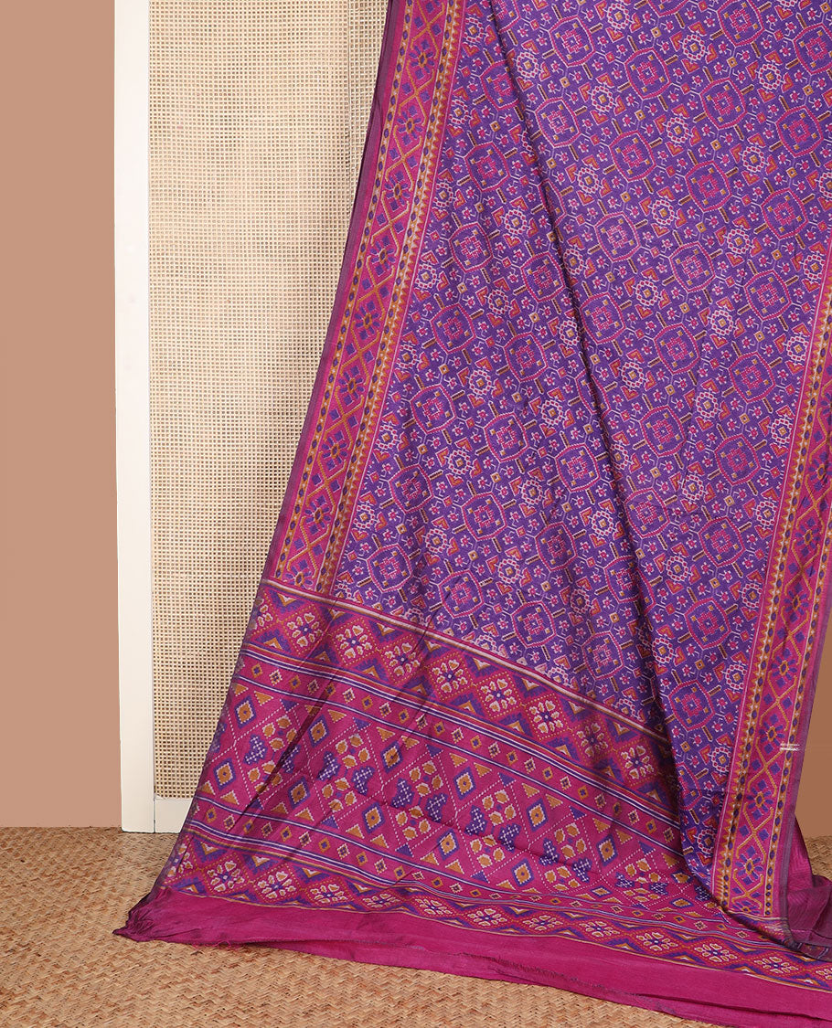 Violet intricately ikkat woven semi-banaras patola silk saree, diamond patterned border, and diamond patterned pallu