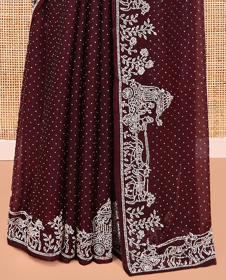 Wine Designer Saree, Scintillated with Stone Struck All Over Its Body, Highlighted by Intricate Stone Work Border, and Paired with a Matching Blouse