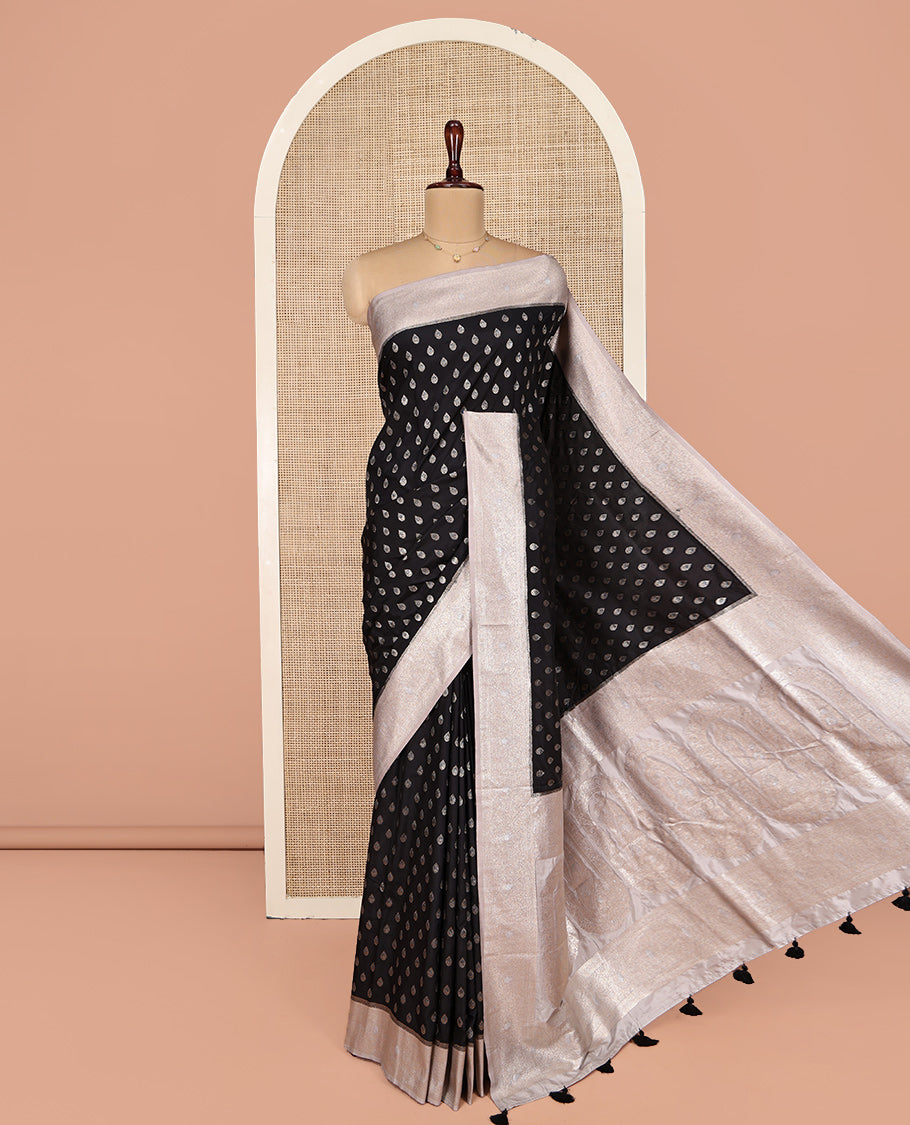 Black Dupion Silk Saree, Beautifully Bedecked with Zari Buttas, Complemented by a Contrast Zari Border, Intricately Designed Pallu, and Has a Contrast Blouse